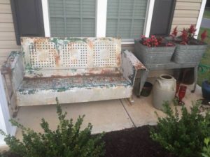 Old metal couch, galvanized pails, ceramic pots