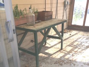 Table on back porch at estate sale