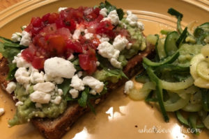 Avocado toast with goat cheese, salsa, and cilantro